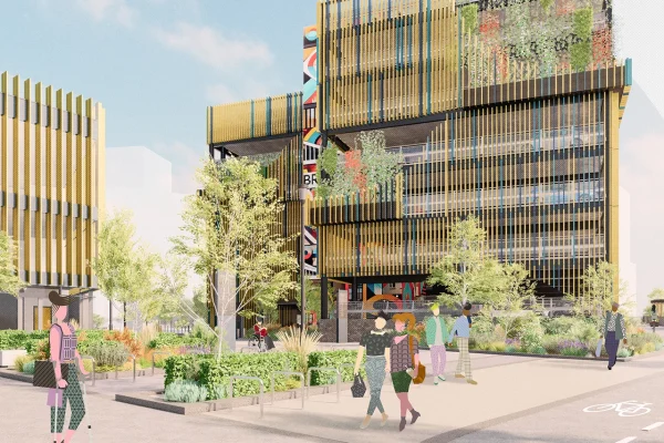 Artist's impression: Street level view looking through the site. A vibrant urban space featuring a pedestrian-friendly walkway bordered by soft landscaping and modern architectural elements. On the right, is a multi-story car park with vertical cladding and planting features. On the left, is a cycle hub, with planters and seating areas enhancing the public space. The pathway, paved with textured materials (similar to Bristol Temple Meads), leads to an open gateway providing connection with Temple Meads Station. The Temple Island development is shown indicatively in the background.