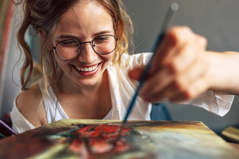 Happy smiling artist painting