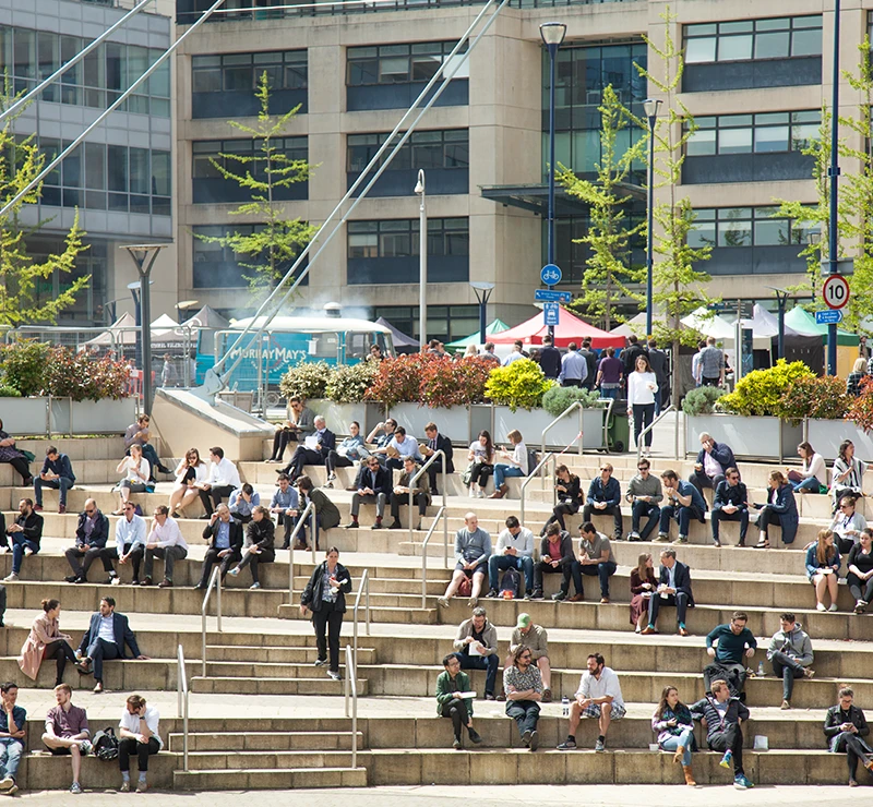 Image of people sat on steps at Temple Quay